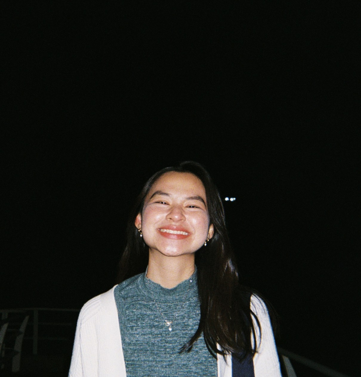 Emma (Khai Hoan) Nguyen, smiling, photographed outdoors at night