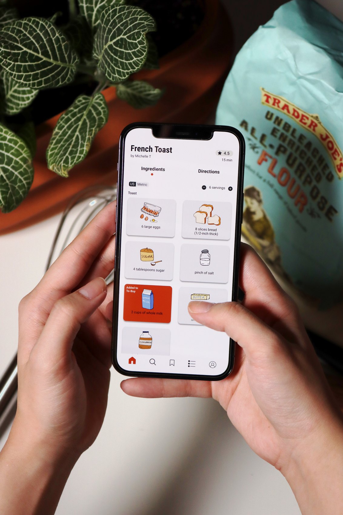The umami app open on a phone held in both hands