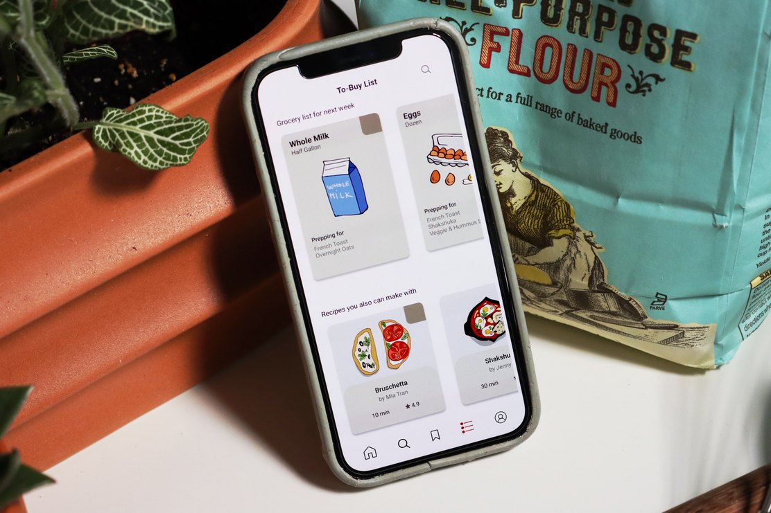 The umami shopping list screen beside a bag of flour